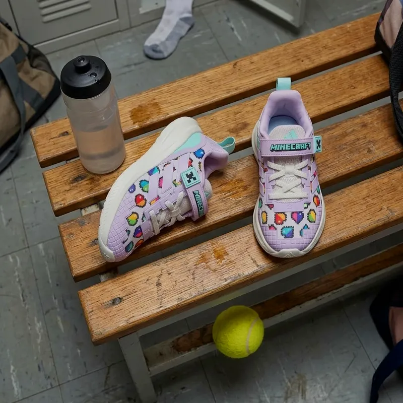 На тренуванні Дитячі кросівки Adidas Minecraft Fortarun EL С для дівчат фіолтеові розові